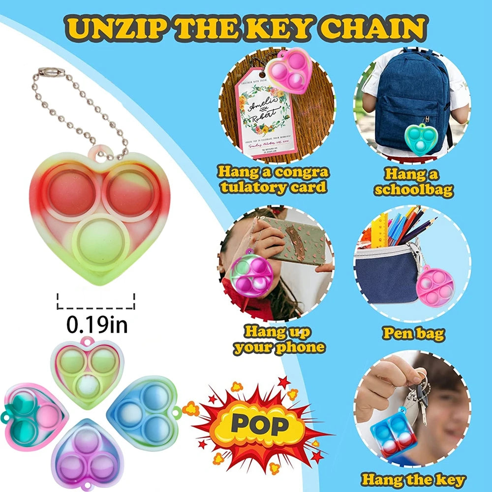 A collection of mini sensory fidget keychains in various colors and shapes, including heart-shaped and oval designs.