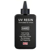 A black bottle of UV resin formulated for artists with a black dropper top.