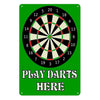 A vintage metal sign featuring a dartboard design with numbers and text that reads Play Darts Here on a green background.