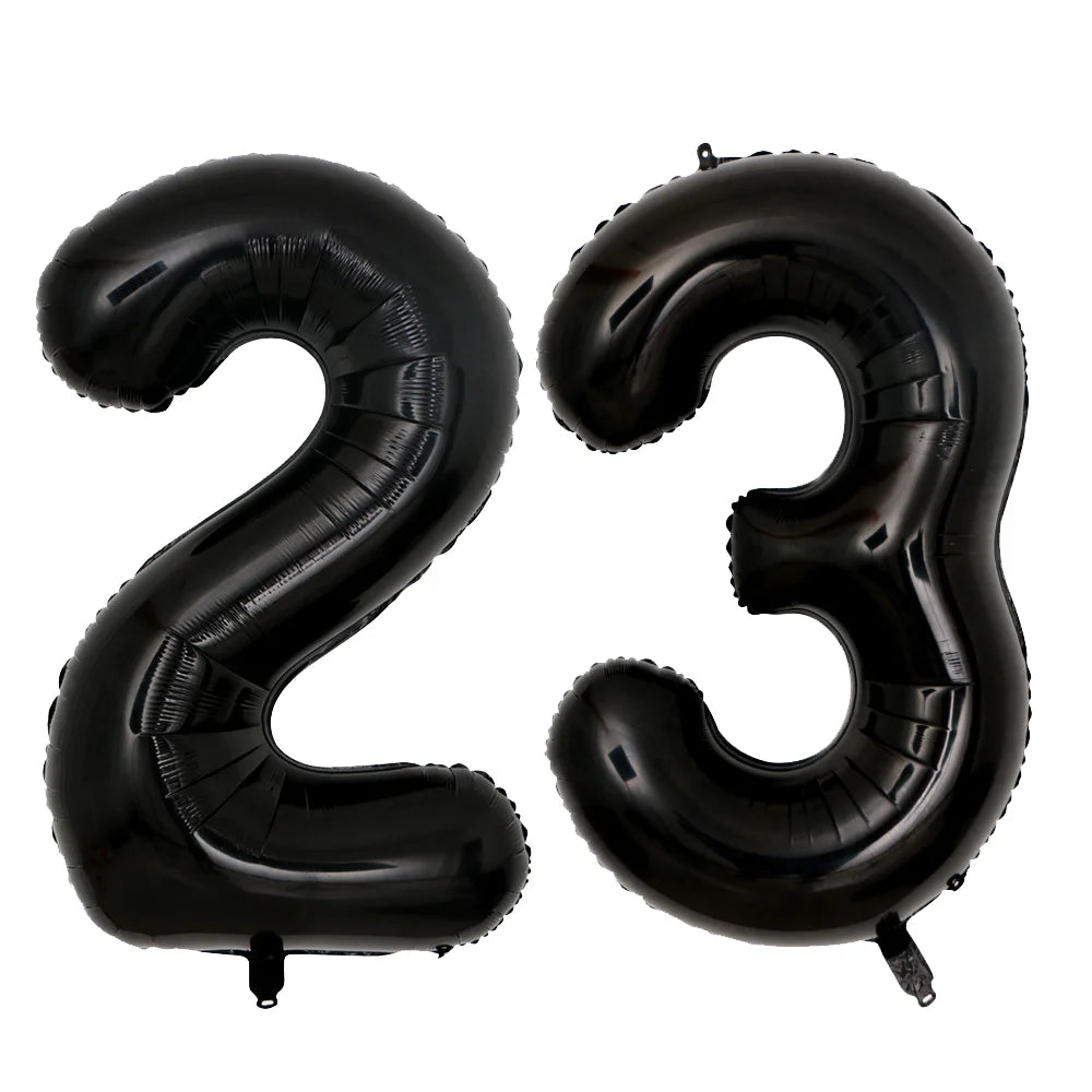 A set of two giant black foil balloons shaped like the number 23