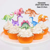 A set of 42 dinosaur-themed party cupcakes with toppers displayed on a white cake stand.