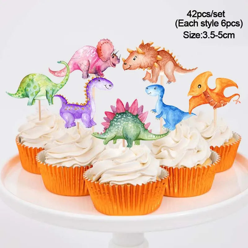 A set of 42 dinosaur-themed party cupcakes with toppers displayed on a white cake stand.