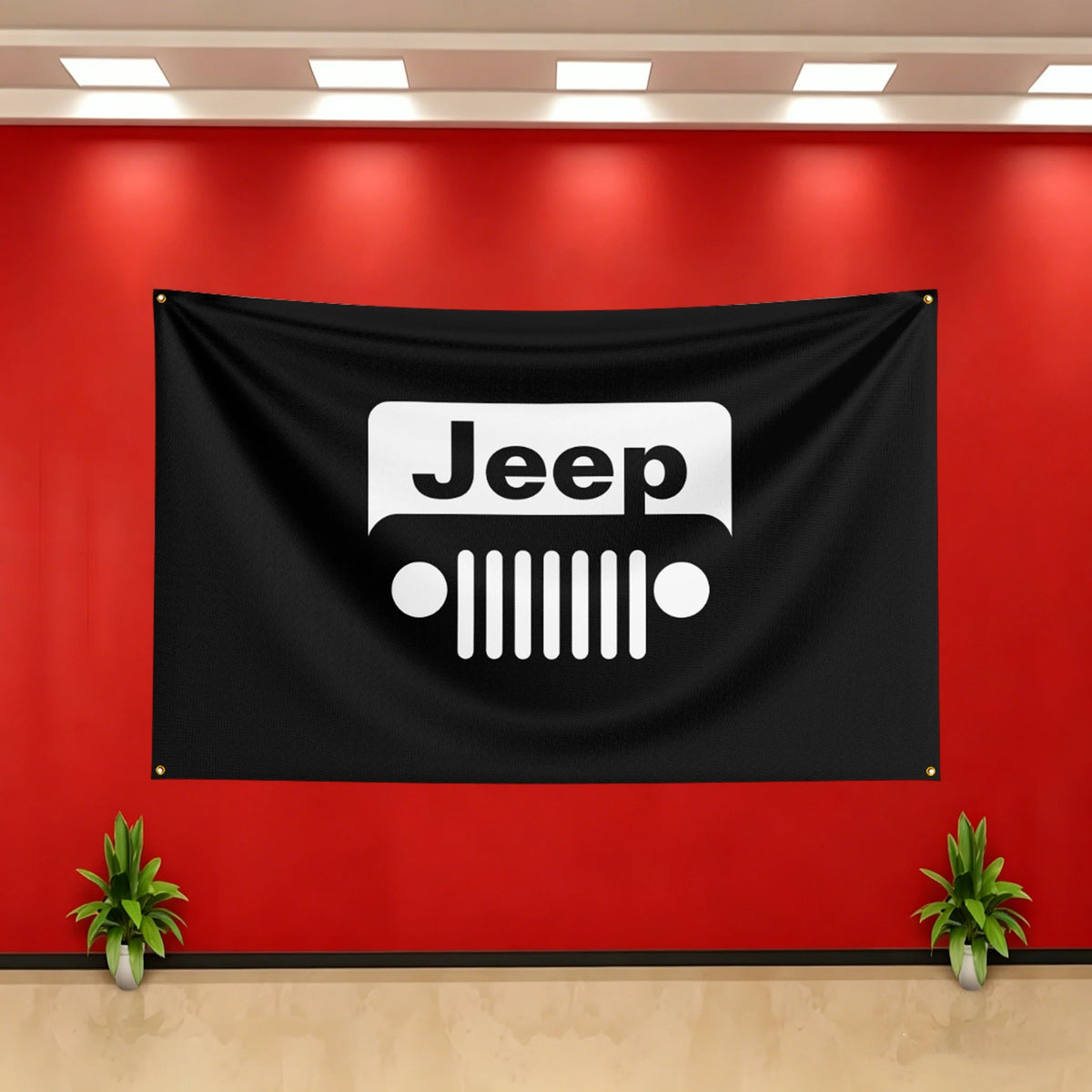A black flag banner featuring the white Jeep logo mounted on a red wall.