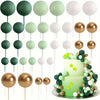 A set of 20 mini foam ball cake toppers in various shades of green and white on wooden sticks.