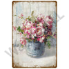 A vintage metal sign featuring a bouquet of pink and white roses in a blue jar.