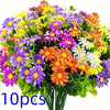 A vibrant bouquet of silk daisies in various colors including yellow, purple, orange, and white.