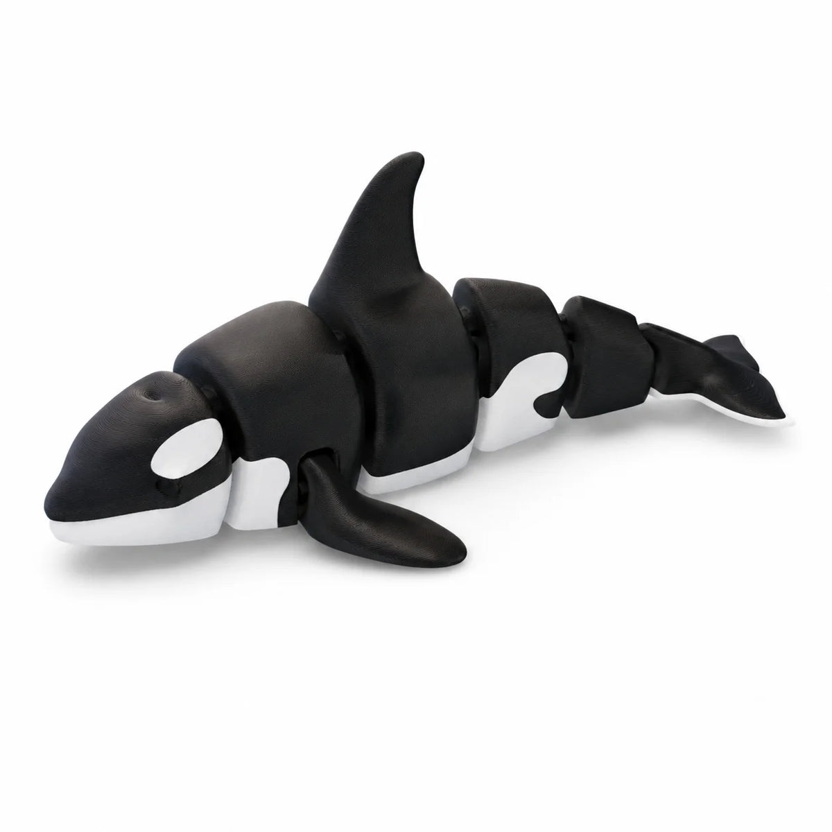 A set of black and white articulated ocean animal figurines.