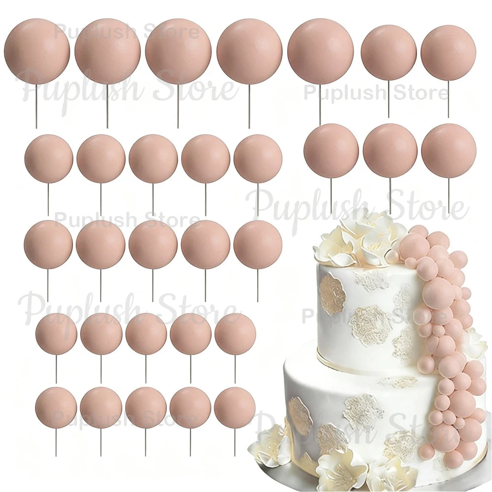 A set of pink foam cake toppers on sticks, including round and petal shapes.