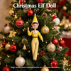 A plush Christmas elf doll decorated with ornaments on a green Christmas tree.