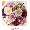 A bouquet of artificial flowers featuring various shades of pink, purple, and cream peonies and eucalyptus.