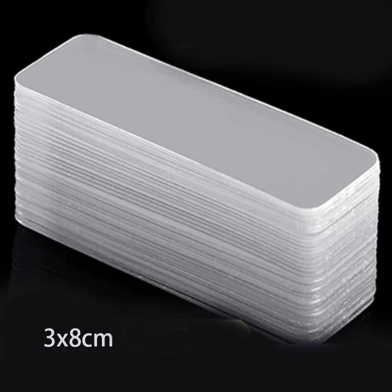 A stack of clear, rectangular double-sided adhesive tape with dimensions 3x8cm.