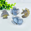 A set of natural agate crystal figurines depicting a bird, a owl, and a turtle on a white background.