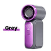 A grey portable rechargeable mini handheld fan with a purple grille and digital display.