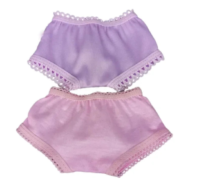 A set of lavender and pink satin doll outfit including a top and bottom piece with lace trim.