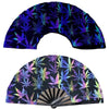 A dark blue folding fan with a vibrant purple and green UV fluorescent cannabis leaf pattern.