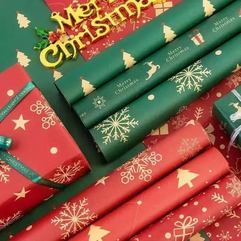 Rolls of festive red and green kraft wrapping paper with Christmas designs and gifts