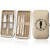 An open leather case displaying an 8-piece stainless steel manicure and pedicure kit with various tools.