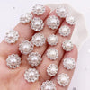 A hand holds a collection of 50 pearl rhinestone flatback crystals for DIY crafts and decor.