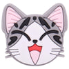A cute cat face charm with gray and pink accents and black markings.
