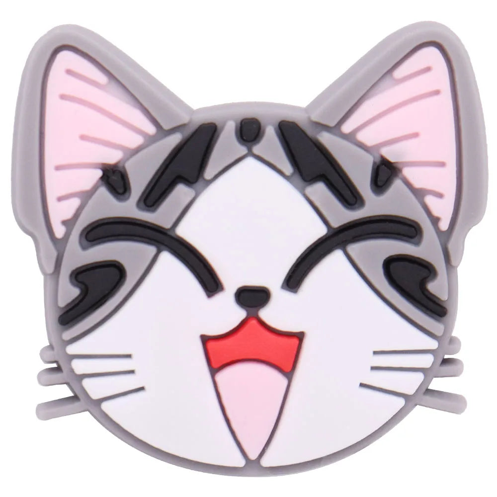 A cute cat face charm with gray and pink accents and black markings.