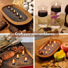 A collection of black pearled candles with wicks and decorative elements for DIY candle making and ambiance.