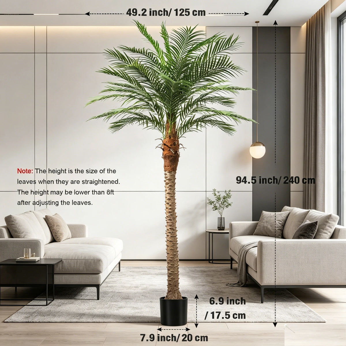 A tall artificial golden palm tree in a pot displayed indoors against a modern white wall.