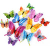 A set of twelve colorful 3D magnetic butterfly wall decor pieces in various shades of pink, purple, yellow, and green.
