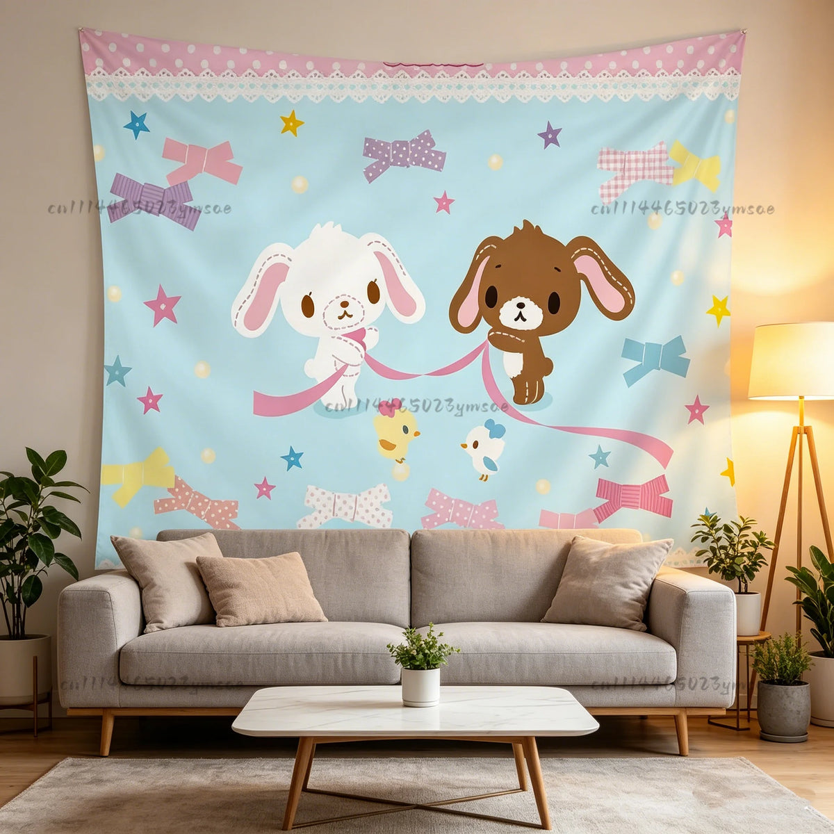 A light blue tapestry featuring whimsical stars and bows, displayed above a modern sofa.
