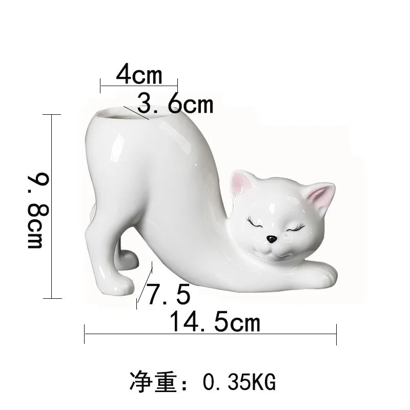 White ceramic cartoon cat planter featuring a sleeping cat design and a long tail.