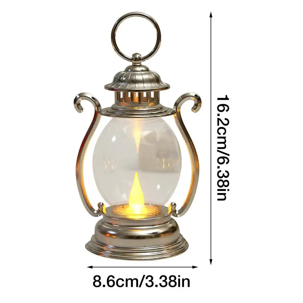 A retro battery-powered desk lamp with a clear glass globe and silver metal accents.