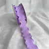 Purple decorative fishtail yarn ribbon displayed against a white background.