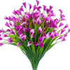 A bouquet of vibrant purple artificial calla lilies with green stems for home decor