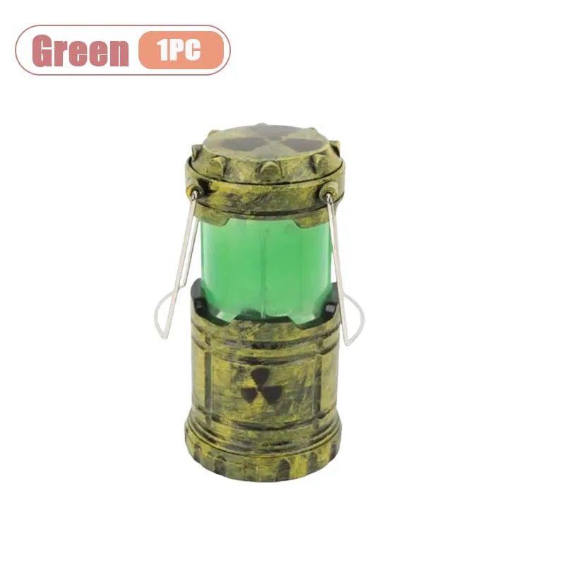 A small, cylindrical lantern-style device with a brass finish and an eerie green glow.
