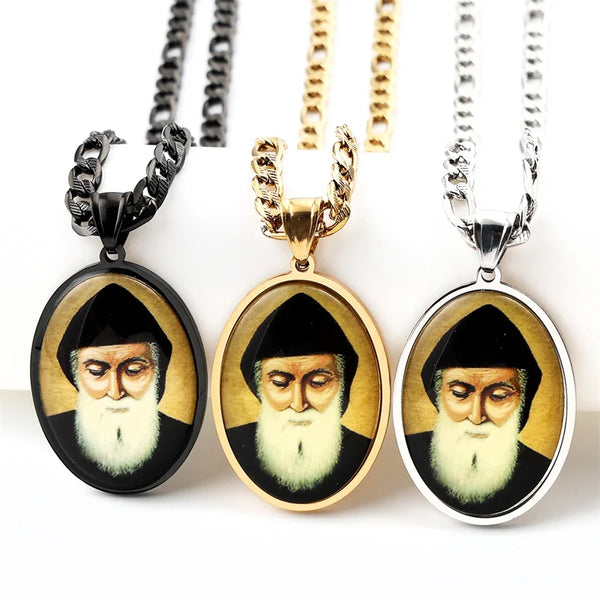 Three glass medal pendants featuring portraits of Saint Charbel set in stainless steel chains
