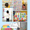 A set of magnetic alphabet and number tiles used for learning, including letters and digits.