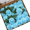 A box filled with light blue foam roses with green leaves for wedding and home décor