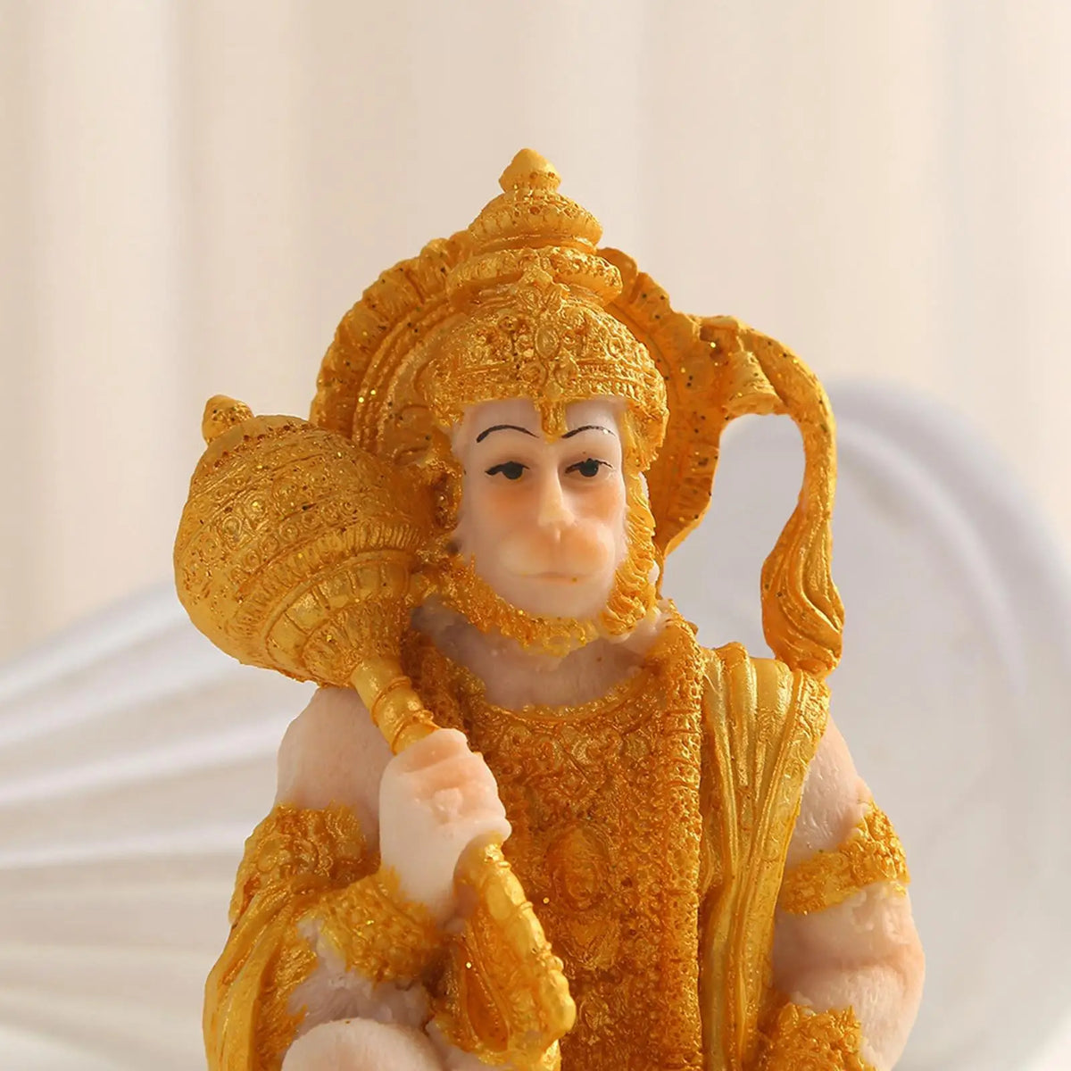 Handcrafted Hanuman resin statue with golden crown and attire for meditation and home decor