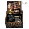 A wooden music box featuring two characters, a woman and a man, in a scene related to married life.