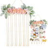 Wall-mounted headband holder featuring pink and green floral accents