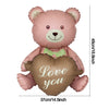 A pink bear foil balloon shaped like a heart with the words Love you on it