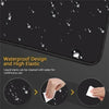Black anime desk mat with a waterproof design and high elastic material showing liquid stains being cleaned.