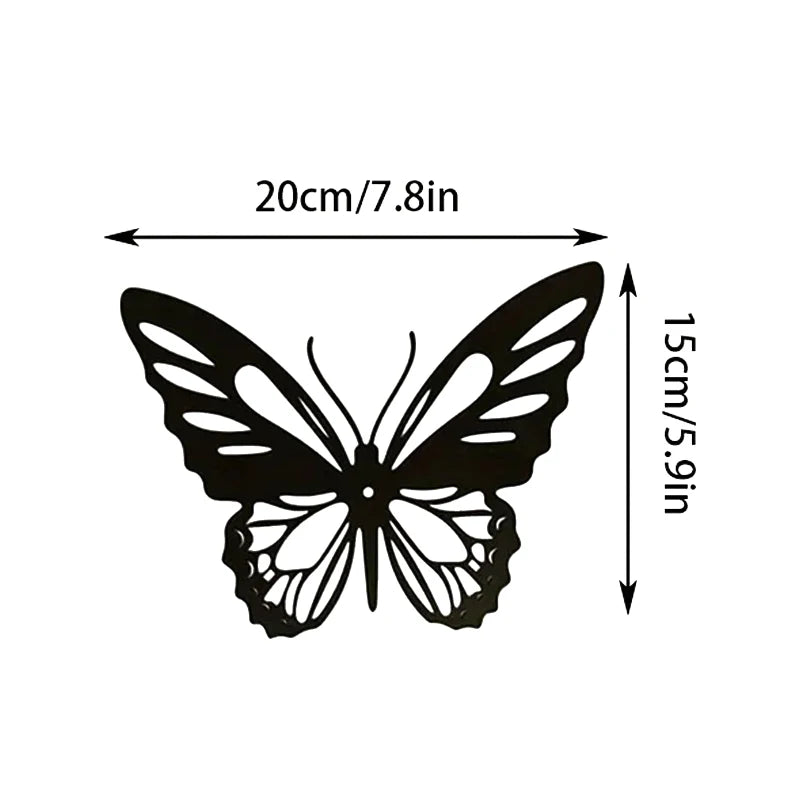 Black metal butterfly wall art featuring detailed wings, measuring 20cm/7.8in wide and 15cm/5.9in tall.