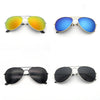 A set of classic pilot sunglasses shown in yellow-orange, blue, and black mirror lenses.