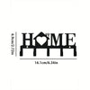 Black wall key holder featuring a heart and home design with hooks for keys and accessories.