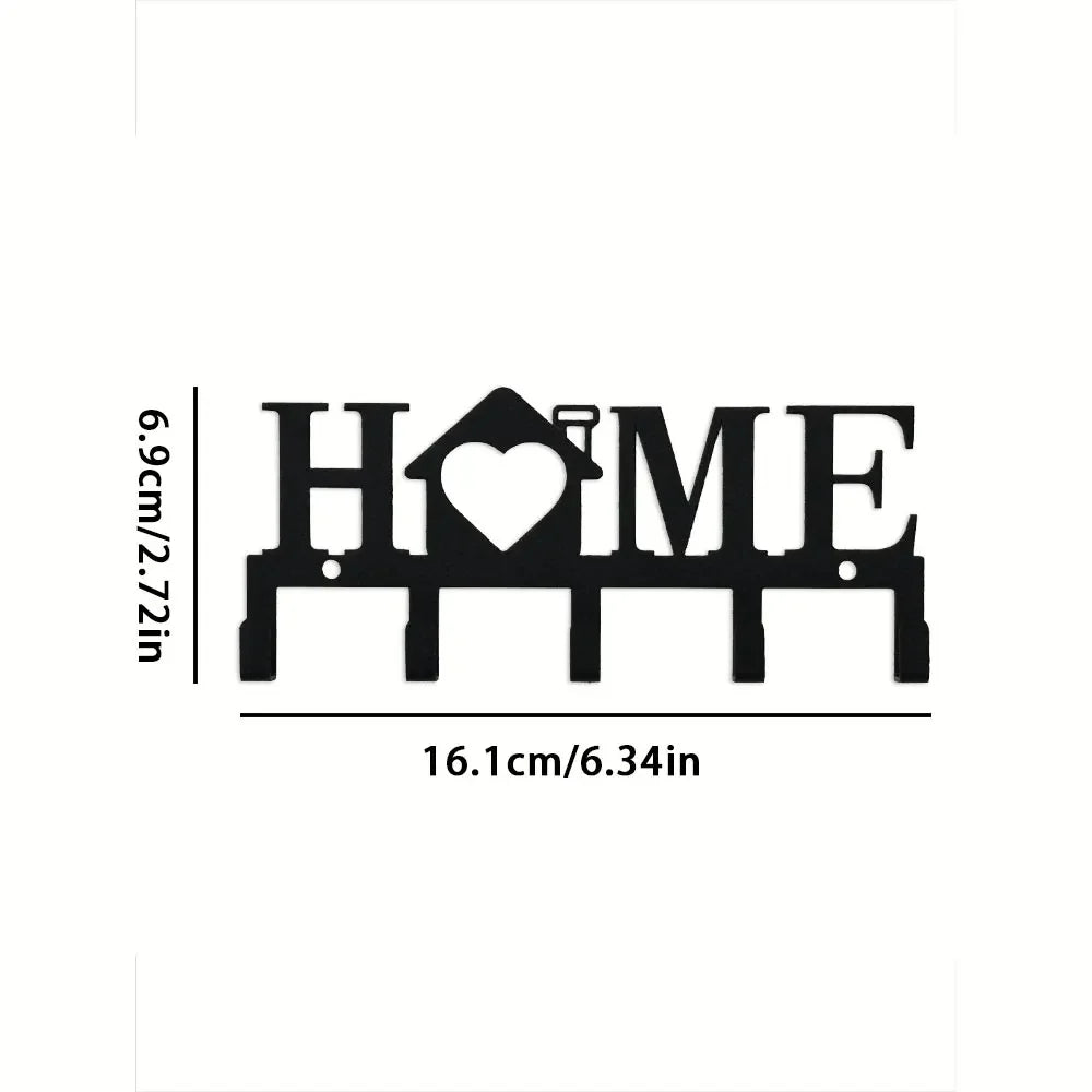 Black wall key holder featuring a heart and home design with hooks for keys and accessories.