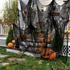 Black creepy gauze cloth draped over a wooden fence for Halloween decor