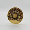 A round gold commemorative iron coin featuring zodiac symbols and celestial designs.
