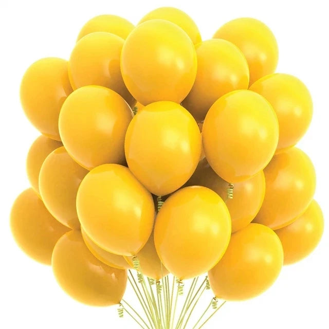 A bunch of yellow latex balloons with a cloud and cow print pattern