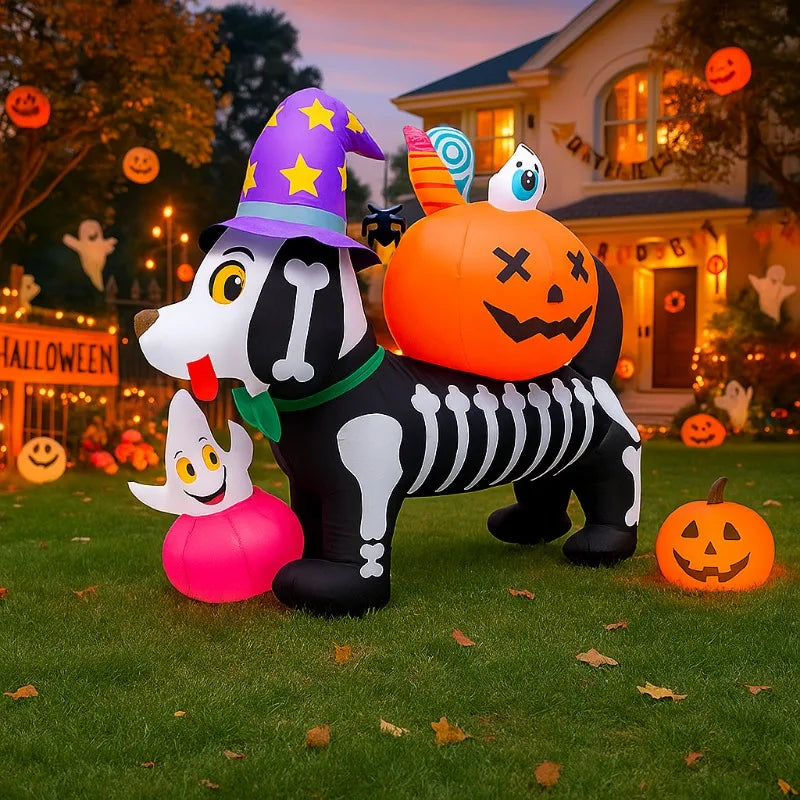 An inflatable Halloween skeleton dog with a pumpkin head and LED lights standing on green grass.