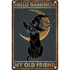 A vintage metal sign featuring a silhouette of a cat in a witch hat against a moon, with the text Hello Darkness My Old Frien